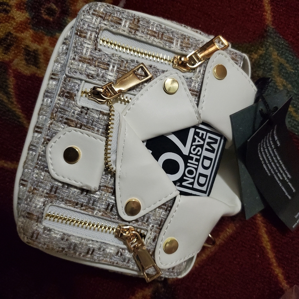 A very trendy style shapedshirt clutch/ crossbody